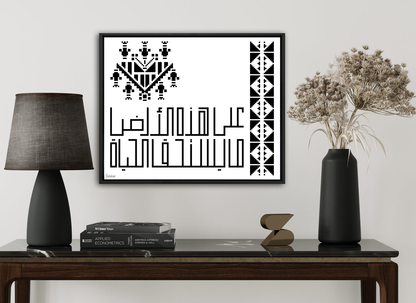 “على هذه الأرض ما يستحق الحياة” translates to “On this earth, there is that which deserves life.” Surrounded by Digital Embroidery work.