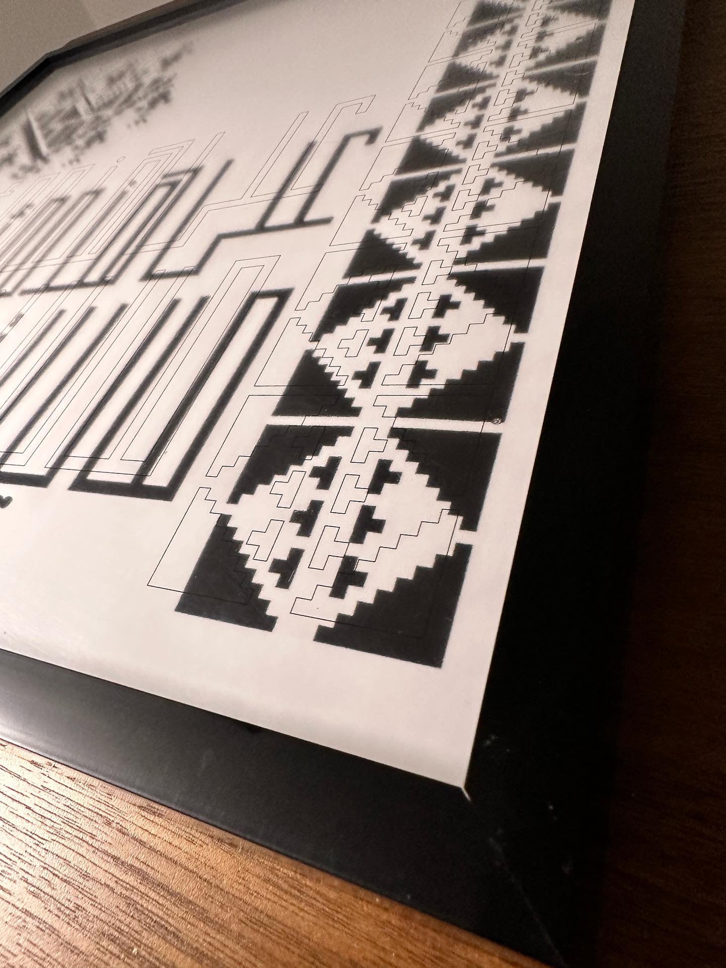 “على هذه الأرض ما يستحق الحياة” translates to “On this earth, there is that which deserves life.” Surrounded by Digital Embroidery work.